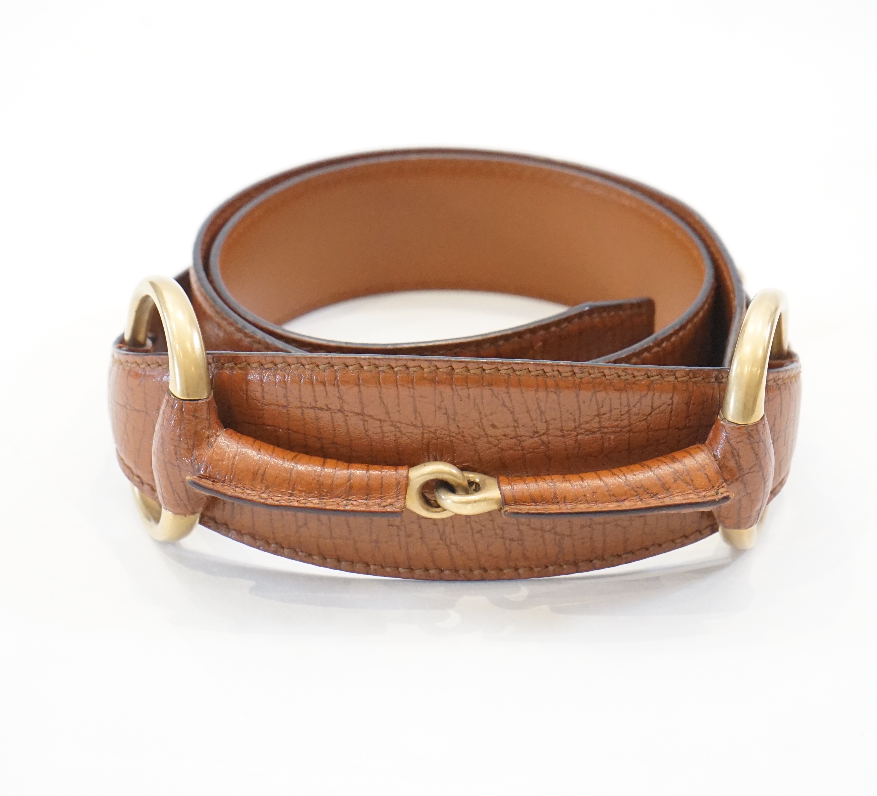 A Gucci horse bit belt in tan leather and gold, Size 90/36